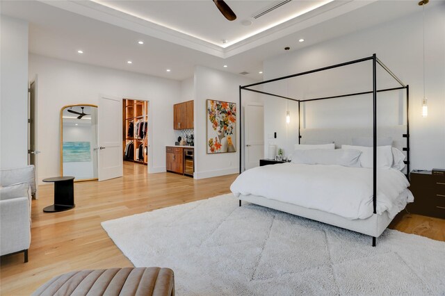 1810 Dunlavy St, Houston, TX 77006 - bedroom with recessed lighting, light wood finished floors, a spacious closet, bar area, and a high ceiling
