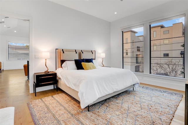 1810 Dunlavy St, Houston, TX 77006 - bedroom with wood finished floors, recessed lighting, and baseboards