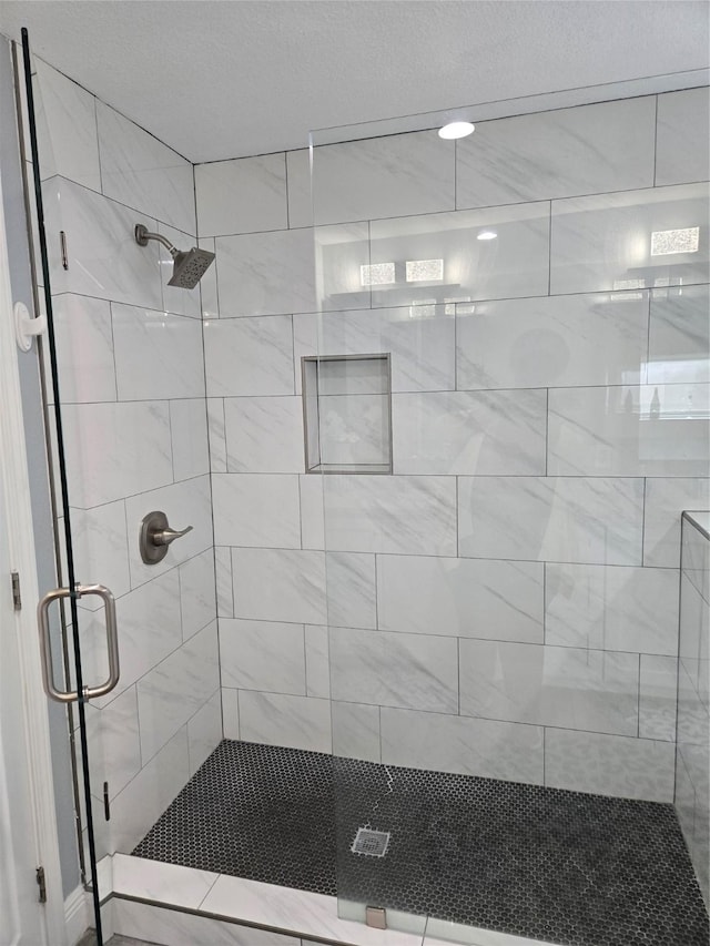 full bath featuring a shower stall