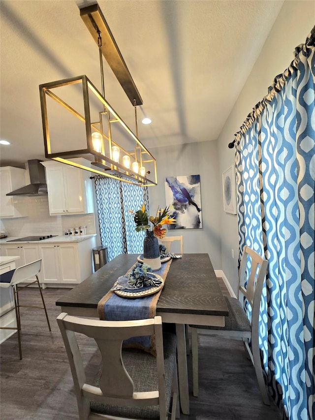 dining room featuring recessed lighting and dark wood-type flooring