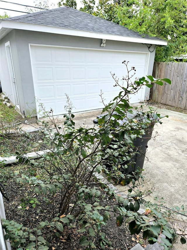 garage featuring fence