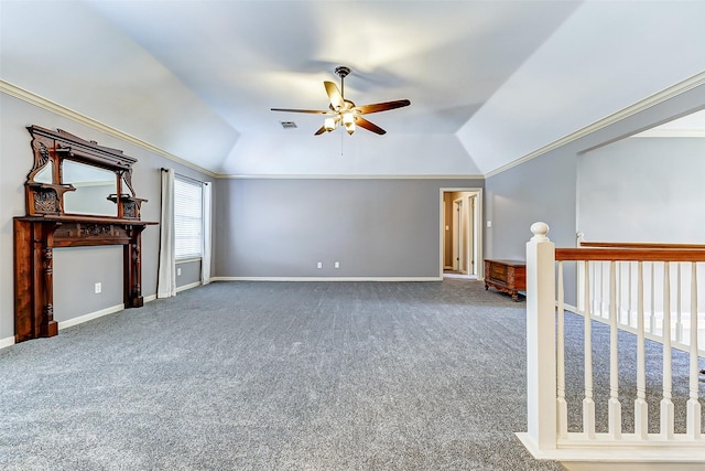 interior space with visible vents, baseboards, ceiling fan, carpet flooring, and lofted ceiling