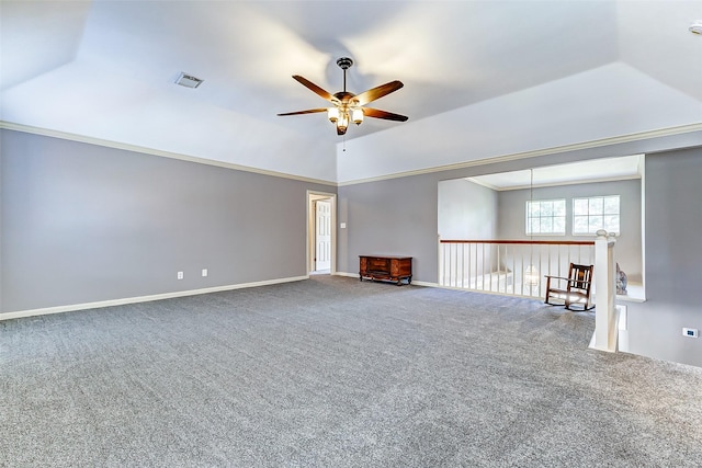 unfurnished living room featuring visible vents, baseboards, a ceiling fan, carpet floors, and lofted ceiling