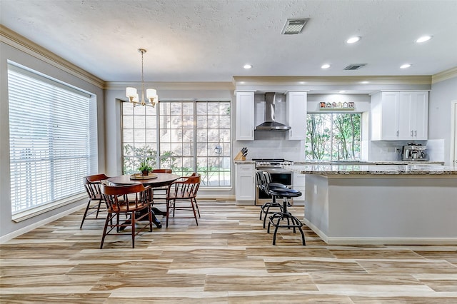 dining area featuring a chandelier, recessed lighting, visible vents, and ornamental molding