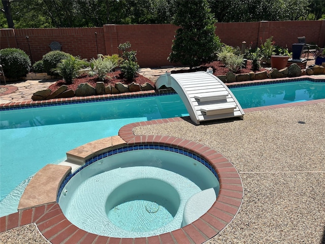 11603 Shoal Landing St, Pearland, TX 77584 - view of pool featuring a fenced backyard and a pool with connected hot tub