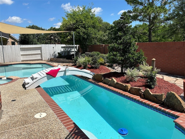 11603 Shoal Landing St, Pearland, TX 77584 - view of swimming pool with a fenced backyard