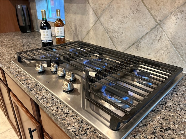 11603 Shoal Landing St, Pearland, TX 77584 - kitchen view of stainless steel gas stovetop and brown cabinets