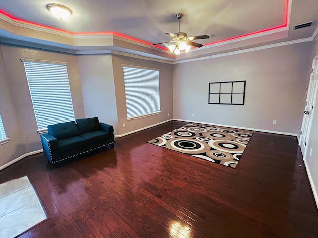11603 Shoal Landing St, Pearland, TX 77584 - sitting room featuring a raised ceiling, wood finished floors, a ceiling fan, crown molding, and baseboards