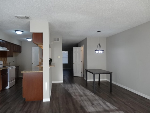 kitchen with white electric stove, dark wood-style floors, visible vents, and under cabinet range hood