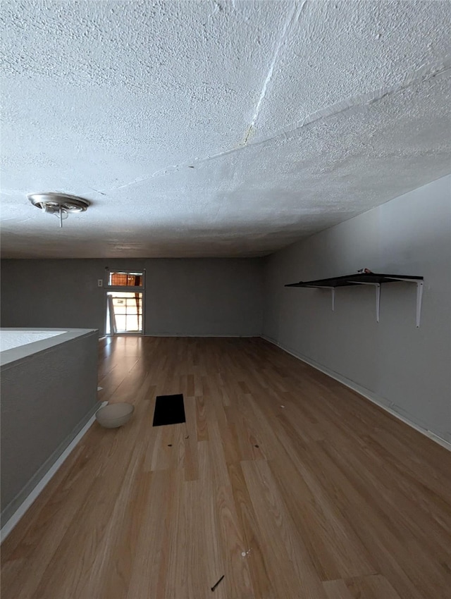 706 66th St Unit 2, Houston, TX 77011 - empty room with a textured ceiling and wood finished floors