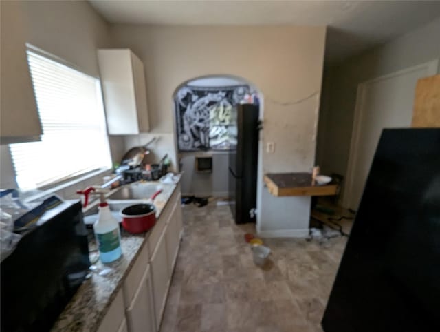 706 66th St Unit 2, Houston, TX 77011 - kitchen with white cabinetry