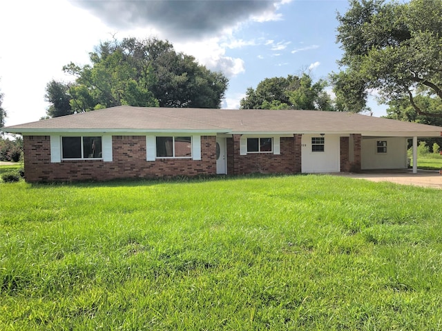 ranch-style house with an attached carport, a front yard, and brick siding