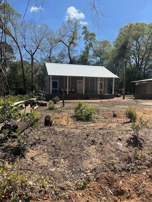 exterior space with metal roof