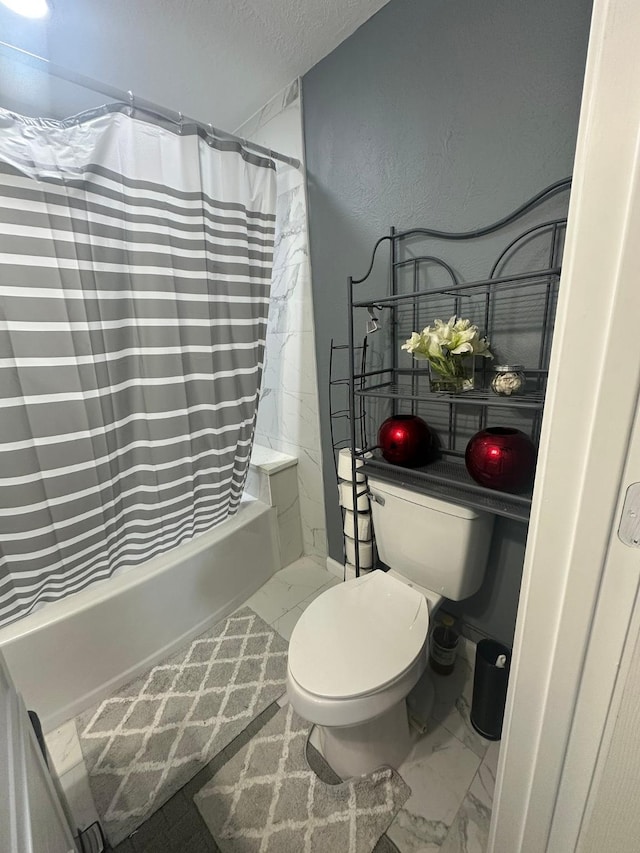 bathroom with toilet, a textured wall, a textured ceiling, marble finish floor, and shower / bath combination with curtain