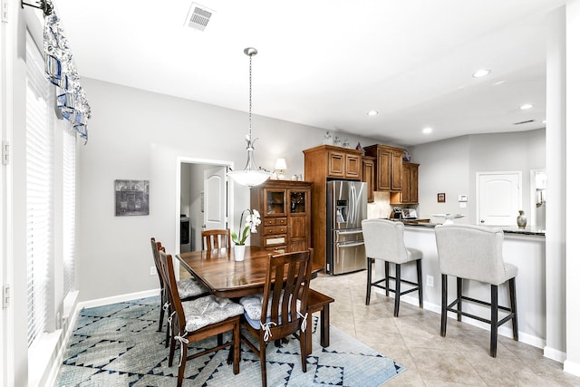 dining area with light tile patterned flooring, baseboards, visible vents, and recessed lighting