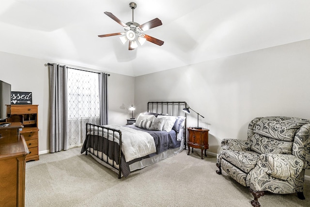 carpeted bedroom with baseboards, lofted ceiling, and ceiling fan