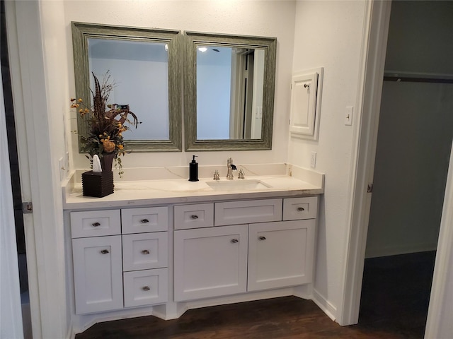 13002 Nantucket Dr, Sugar Land, TX 77478 - bathroom featuring wood finished floors and vanity
