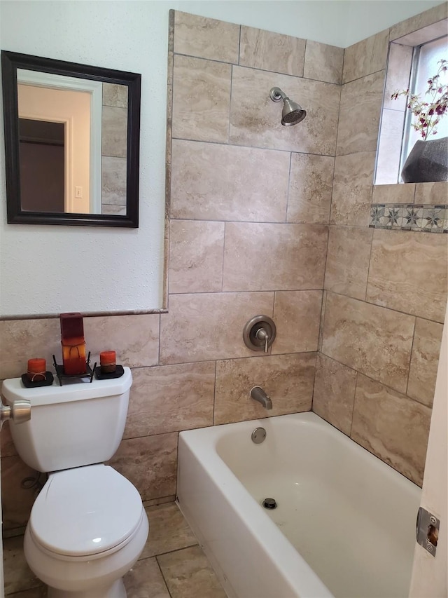 13002 Nantucket Dr, Sugar Land, TX 77478 - bathroom featuring tile walls, shower / bath combination, and toilet