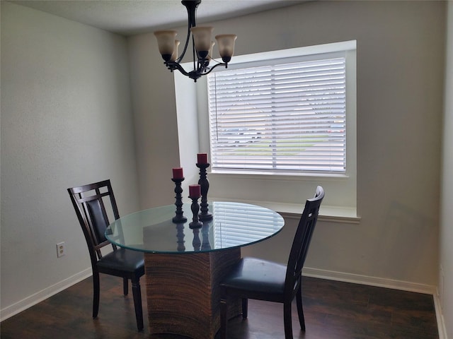 13002 Nantucket Dr, Sugar Land, TX 77478 - dining area with wood finished floors, baseboards, and a notable chandelier
