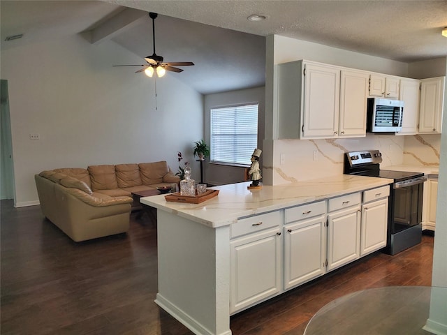 13002 Nantucket Dr, Sugar Land, TX 77478 - kitchen featuring ceiling fan, lofted ceiling with beams, stainless steel appliances, and dark wood-type flooring
