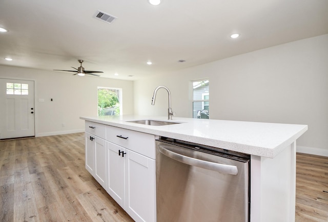 kitchen featuring a sink, dishwasher, light wood finished floors, visible vents, and recessed lighting