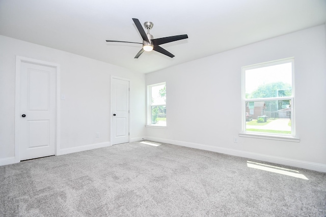 unfurnished bedroom featuring baseboards, carpet, and ceiling fan