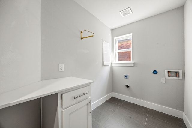 laundry room with cabinet space, electric dryer hookup, visible vents, hookup for a washing machine, and baseboards