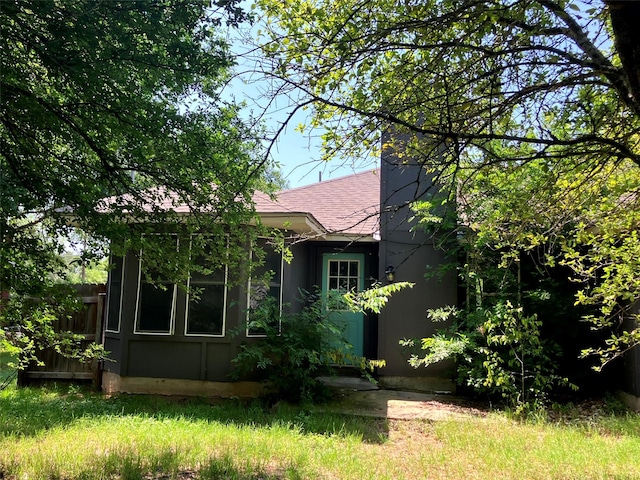 193 Oak River Dr, Cedar Creek, TX 78612 - back of property featuring roof with shingles and fence