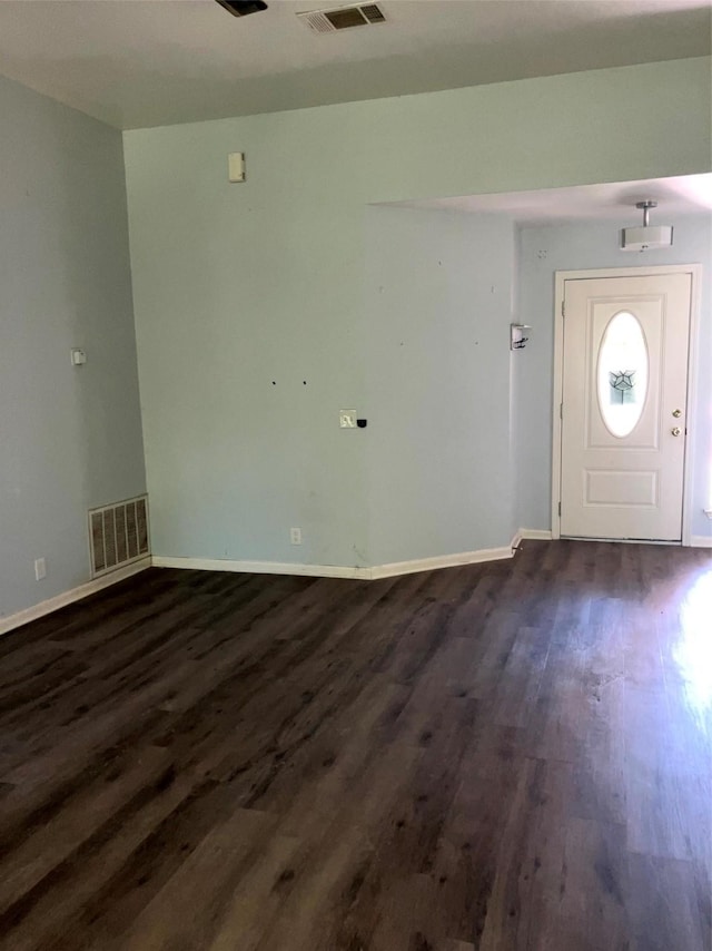 193 Oak River Dr, Cedar Creek, TX 78612 - foyer with dark wood-style floors and baseboards