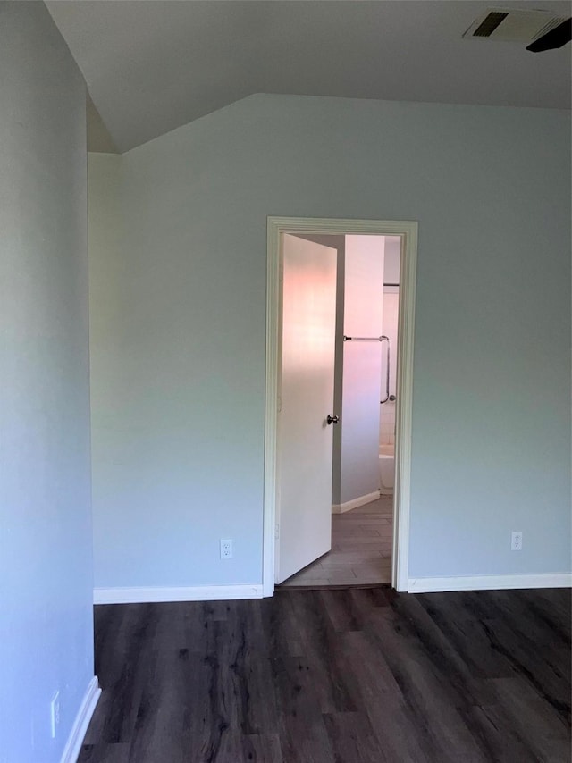 193 Oak River Dr, Cedar Creek, TX 78612 - unfurnished room with wood finished floors, vaulted ceiling, and baseboards