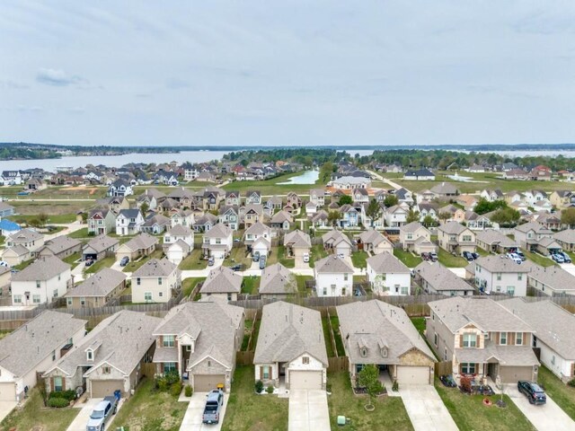 13088 Laura Lake Dr, Willis, TX 77318 - aerial view featuring a water view and a residential view