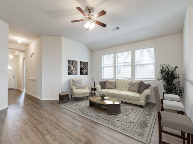 13088 Laura Lake Dr, Willis, TX 77318 - living room with wood finished floors, baseboards, a ceiling fan, and visible vents
