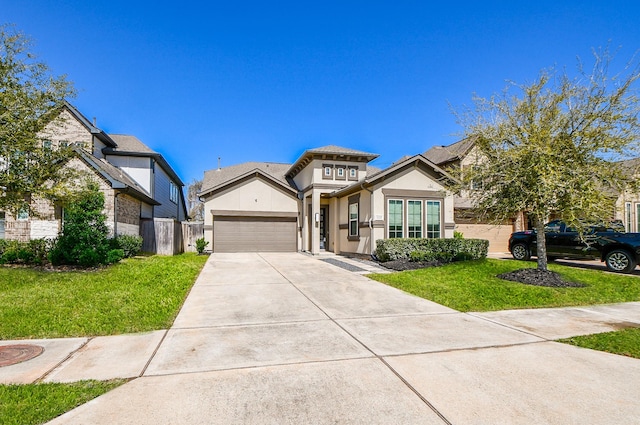 11115 Elderflower Dr, Missouri City, TX 77459 - view of front facade with stucco siding, an attached garage, and concrete driveway