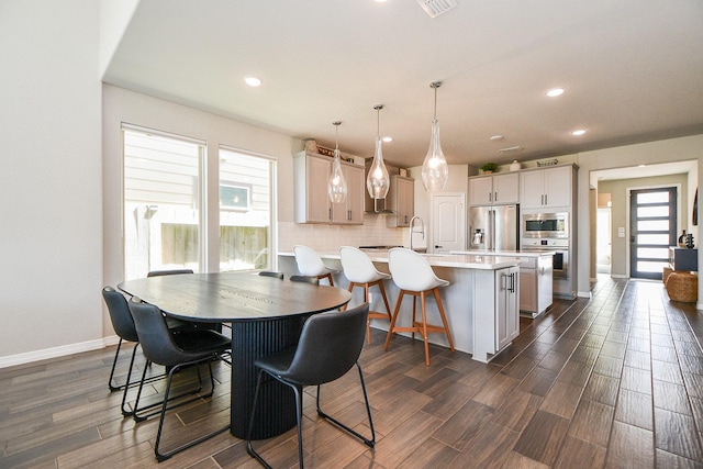 11115 Elderflower Dr, Missouri City, TX 77459 - dining space featuring dark wood-type flooring, recessed lighting, and baseboards