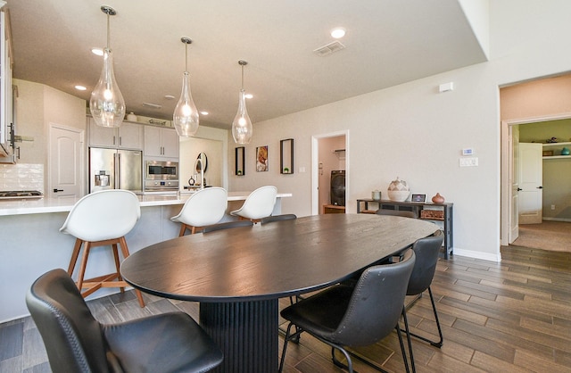 11115 Elderflower Dr, Missouri City, TX 77459 - dining space with dark wood-style flooring and recessed lighting
