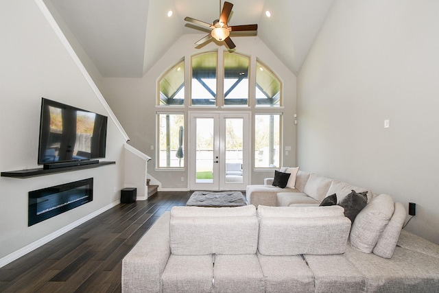 11115 Elderflower Dr, Missouri City, TX 77459 - living room with dark wood-style flooring, stairway, lofted ceiling, ceiling fan, and french doors