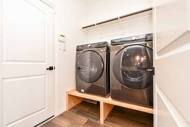 11115 Elderflower Dr, Missouri City, TX 77459 - laundry area with washing machine and dryer and wood finished floors