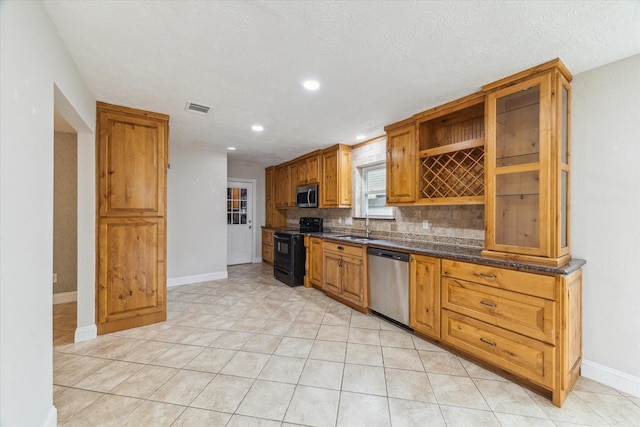 4010 Bluebonnet Trl, Deer Park, TX 77536 - kitchen with stainless steel appliances, open shelves, backsplash, recessed lighting, and light tile patterned flooring