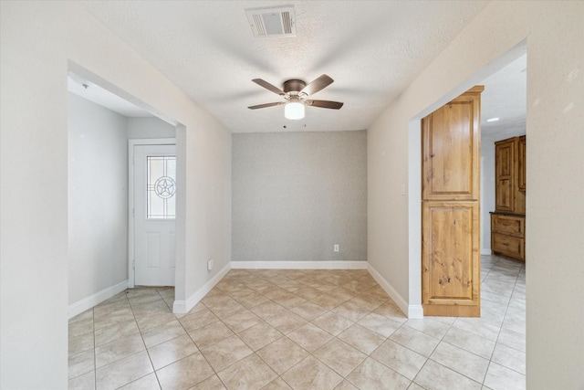 4010 Bluebonnet Trl, Deer Park, TX 77536 - spare room with a ceiling fan, light tile patterned floors, and a textured ceiling