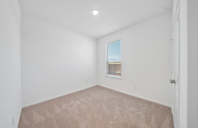 10710 Sora Dr, Willis, TX 77378 - spare room with light colored carpet and baseboards