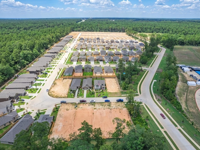 10710 Sora Dr, Willis, TX 77378 - aerial overview of property's location featuring a heavily wooded area and nearby suburban area