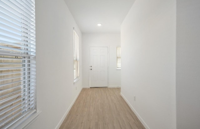10710 Sora Dr, Willis, TX 77378 - corridor featuring light wood-style flooring, baseboards, and recessed lighting