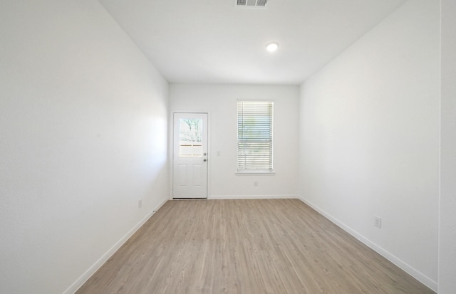 10710 Sora Dr, Willis, TX 77378 - spare room with light wood-type flooring and baseboards