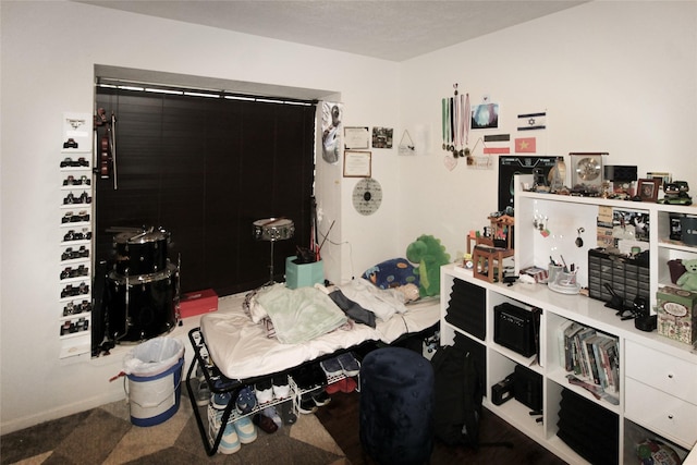 carpeted bedroom with baseboards