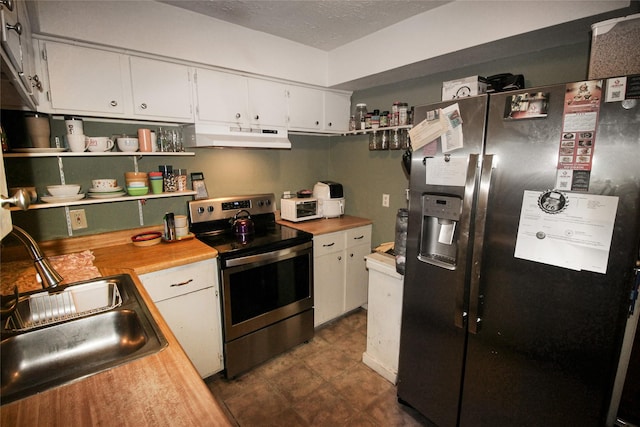 kitchen featuring white cabinets, under cabinet range hood, appliances with stainless steel finishes, and a textured ceiling
