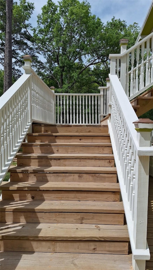 wooden deck featuring stairs