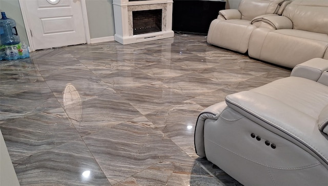 living area featuring marble finish floor