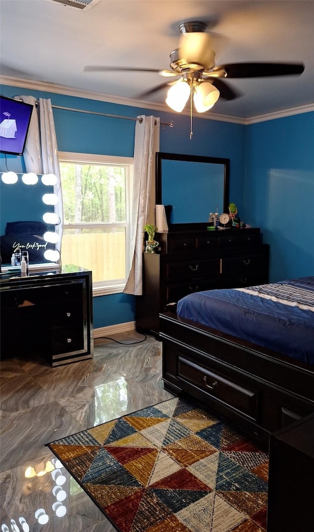 bedroom with a ceiling fan, crown molding, and baseboards