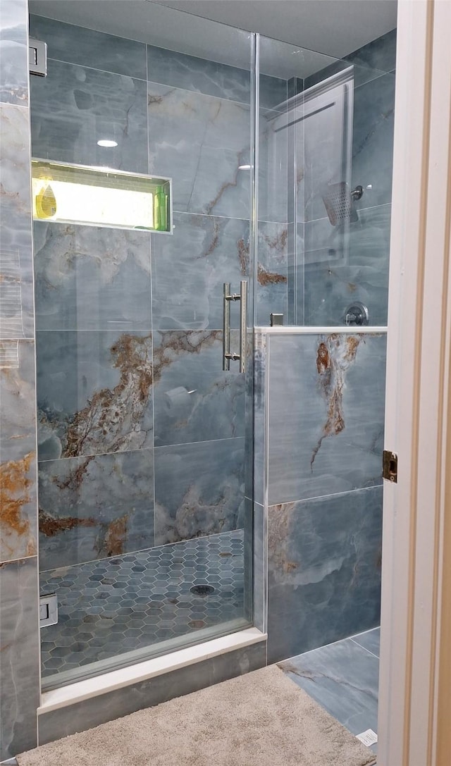 full bathroom featuring a stall shower