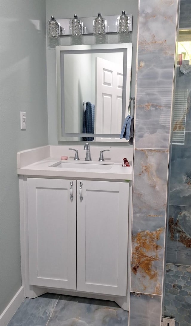 bathroom featuring baseboards and vanity